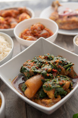 African national food dish grilled meat and chicken dish wings home-made Cuisine with plantain with jollof rice. Nigerian Jolofrice. Grilled African fish dish and meal with chilli banana and plantain.