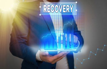 Conceptual hand writing showing Recovery. Concept meaning the return to normal state of health mind...