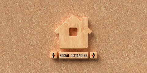 wooden house symbol and cubes with message SOCIAL DISTANCING on cork background