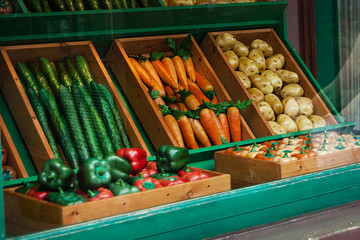 Potatoes, cucumbers, carrots and peppers on the counter at the market
