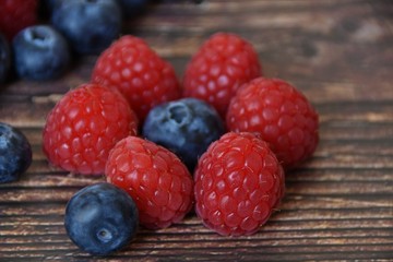 ripe raspberries and blueberries closeup