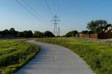Fototapeta na wymiar Concrete path urban trail on a sunny spring evening.