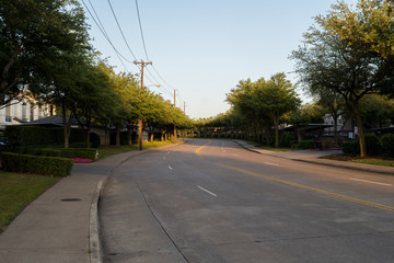 City street on a sunny spring evening in Dallas, Texas.