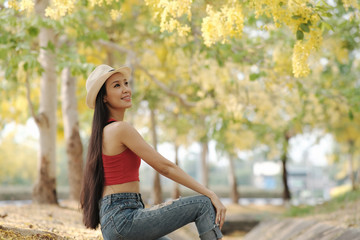 portrait of beautiful woman in yellow dress with summertime