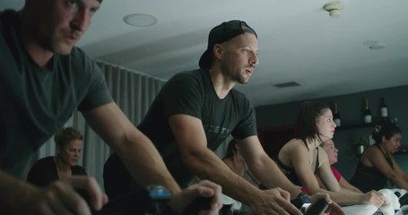 Group of people taking spin class
