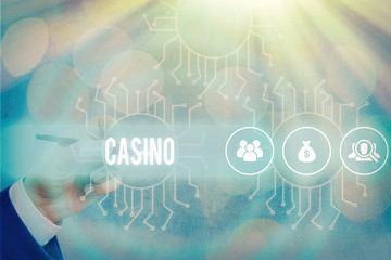 Conceptual hand writing showing Casino. Concept meaning a building where games especially roulette and card games are played