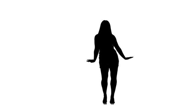 black silhouette on a white background young beautiful woman with long hair and a beautiful figure dances belly dance, oriental dance, exotic dance, slow motion