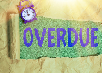 Writing note showing Overdue. Business concept for loans and other obligations remaining unpaid...