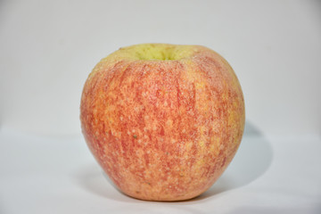 red apple on a wooden table
