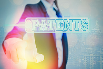 Conceptual hand writing showing Patents. Concept meaning government authority or licence conferring...