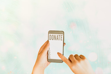 Conceptual hand writing showing Donate. Concept meaning give money or goods for good cause for...