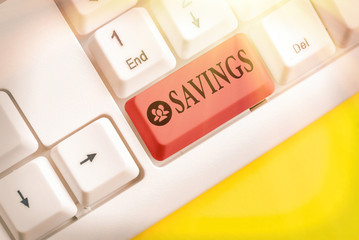 Conceptual hand writing showing Savings. Concept meaning the money that a demonstrating keeps in an...