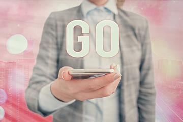 Conceptual hand writing showing Go. Concept meaning to move or travel somewhere in order to do...