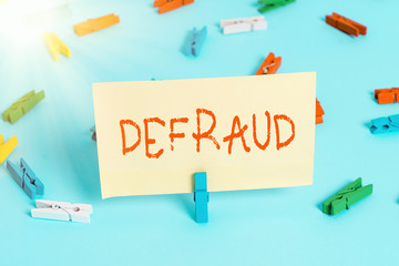 Conceptual hand writing showing Defraud. Concept meaning to trick or cheat someone or something in...