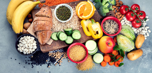 Obraz na płótnie Canvas Foods high in carbohydrates on grey background
