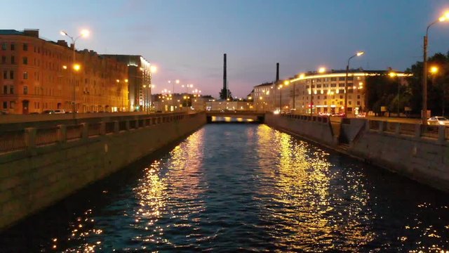 Aerial shot over a canal in Saint Petersburg during the "White Nights" phenomenon, Russia