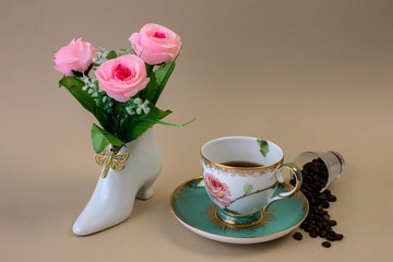 .coffee, flowers, candles on a beige background as a symbol of home warmth and coziness