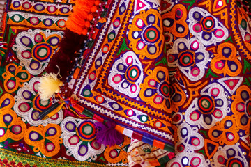 Mirrored embroidery work typical of the Aahir tribe in Gujarat,india,Rajeshthan India embroidery close up view,handwork embroidery,selective focus on handmade embroidery. Traditional Indian handmade e