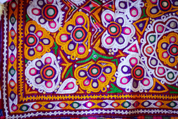 Mirrored embroidery work typical of the Aahir tribe in Gujarat,india,Rajeshthan India embroidery close up view,handwork embroidery,selective focus on handmade embroidery. Traditional Indian handmade e
