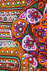 .Threads for embroidery,handmade stitch pattern close up view, Ahir Embroidery vintage style,Indian patchwork carpet in india,craftsman embroidering cloth in traditional Indian