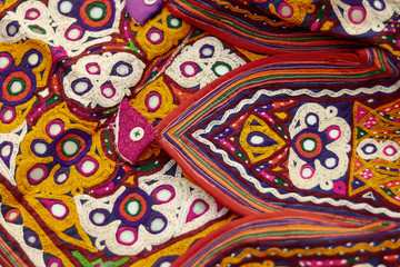 Handmade tribal skirt with embroidery and mirror work,selective focus,embroidery seen in India and Pakistan,pattern arts close up