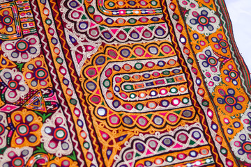 ahir tribe traditional and multi colors homemade embroidery arts close up, embroidery background and texture beautiful view, needlework and pattern art embroidery view, selective focus