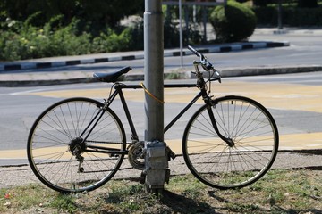 Fototapeta na wymiar the bicycle locked on the lock