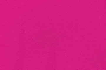 Purple homogeneous background with a textured surface. Gray fabric.