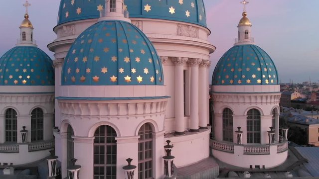 Aerial ascending on the historical Trinity Cathedral at sunrise, Saint Petersburg, Russia