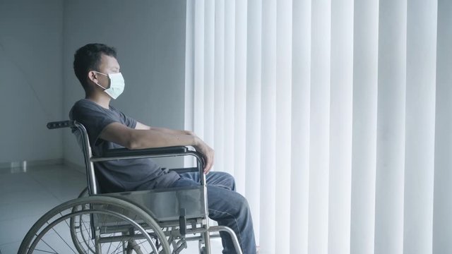 Disabled man looks depressed during quarantine