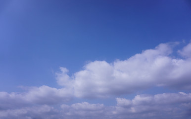 white and gray clouds under deep blue sky
