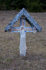 old crucifix with tin roof