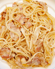 Carbonara pasta, spaghetti with pancetta, egg, hard parmesan cheese and cream sauce. Traditional italian cuisine