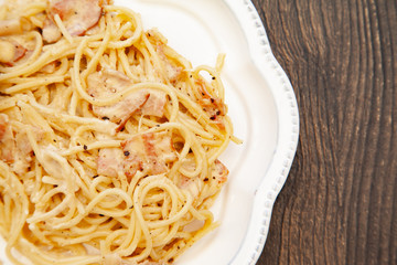 Carbonara pasta, spaghetti with pancetta, egg, hard parmesan cheese and cream sauce. Traditional italian cuisine