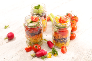 rainbow vegetable salad in jar and ingredient