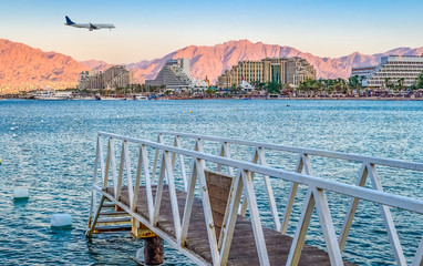 Central public beach in Eilat - Israeli southernmost and famous resort tourist city, located on the northern shores of the Red Sea