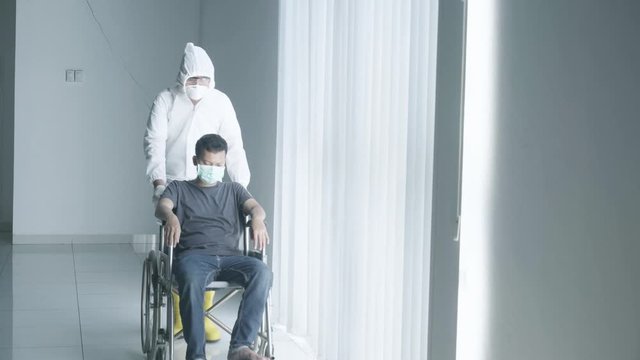 Man on wheelchair with his doctor during quarantine