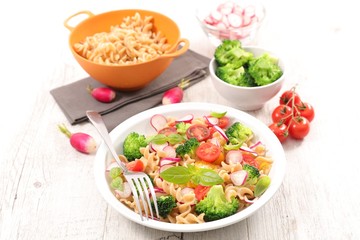 pasta salad with broccoli, radish and tomato