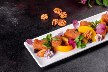 Fresh scented cheese sticks with baked apple and peach decorated with flowers