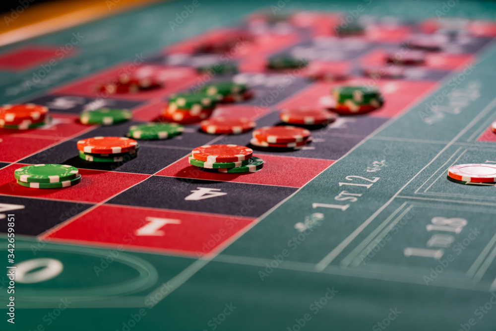 Wall mural roulette table close up at the casino - selective focus