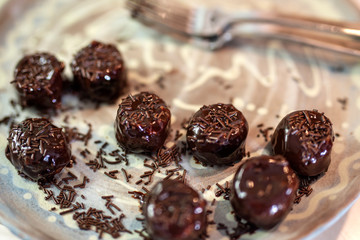 Handmade chocolate cakes in little baskets with sprinkles on top