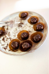 Handmade chocolate cakes in little baskets with sprinkles on top