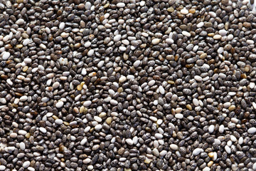 Chia seeds close-up background macro. The texture of the Chia seeds. Copy space. Flat lay. Healthy food from Chia seeds.