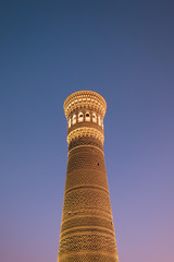 Middle Asia. Uzbekistan Bukhara. Summer. Eastern mosque. Poi Kalyan complex. The main tower in illumination against the blue night sky
