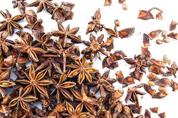 heap star anise top view on white background.