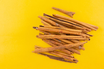 cinnamon on yellow background.