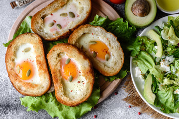 Delicious breakfast with grunts, eggs, avocado and cherry tomatoes