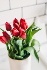 Red tulips easter decoration in a home. Spring concept