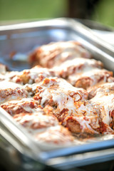 Catered tray of Chicken Parmesan for a party ceremony