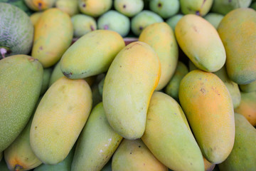 Mango on the counter in the market .